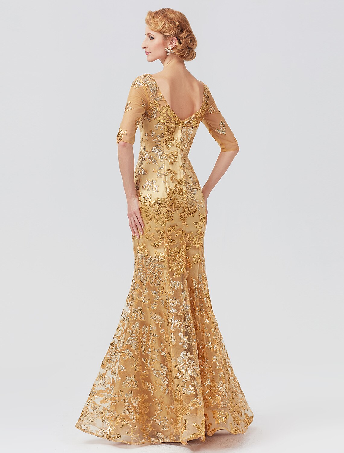 Close-up of the sequined tulle fabric and V-neckline of the elegant dress.