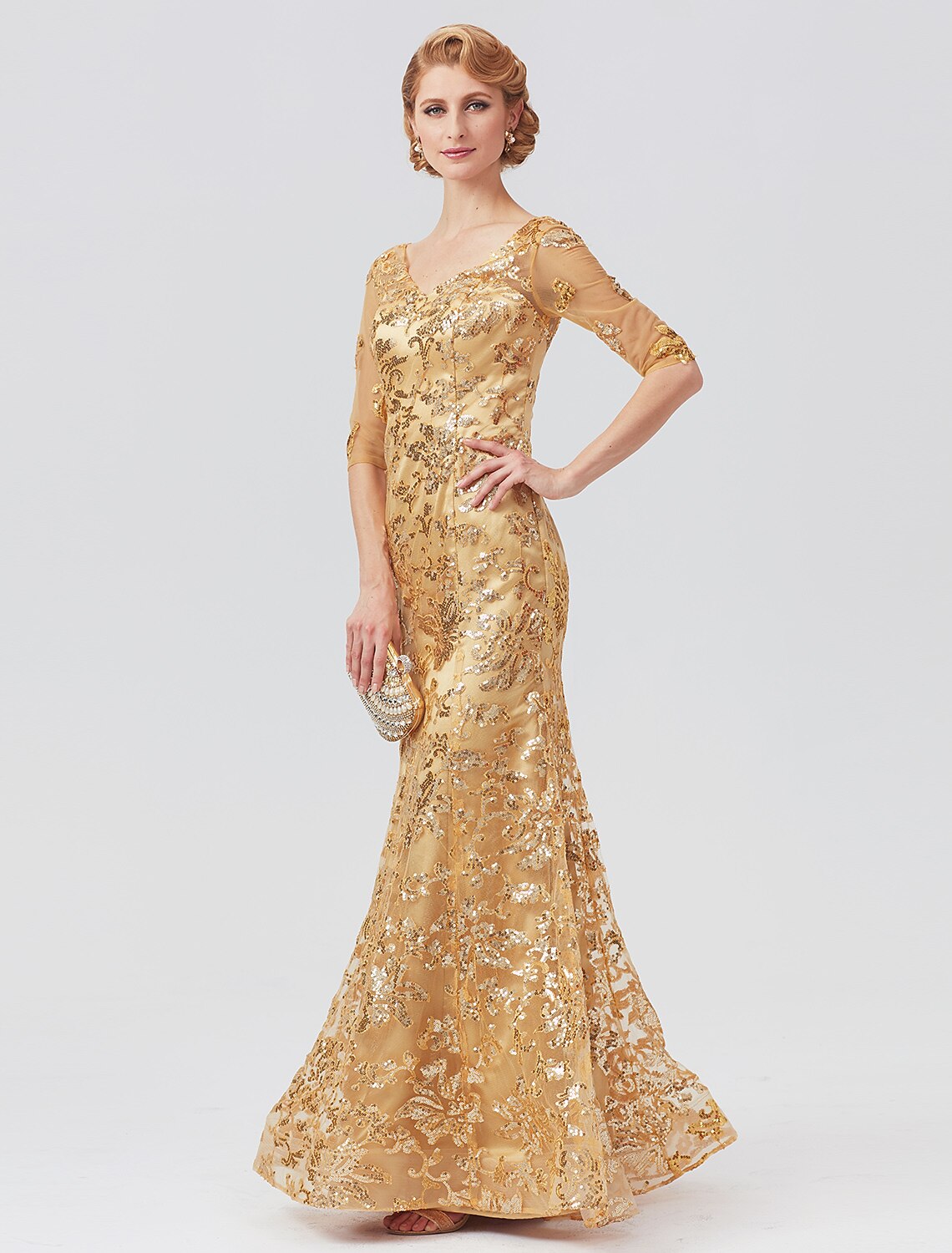 Back view of the floor-length mermaid/trumpet dress with sequin details.