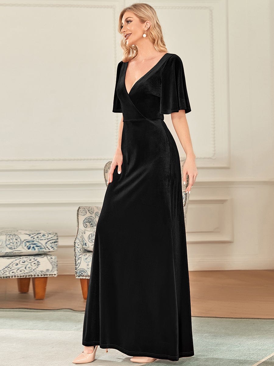 Back view of the black velvet dress, highlighting the V-neck design.