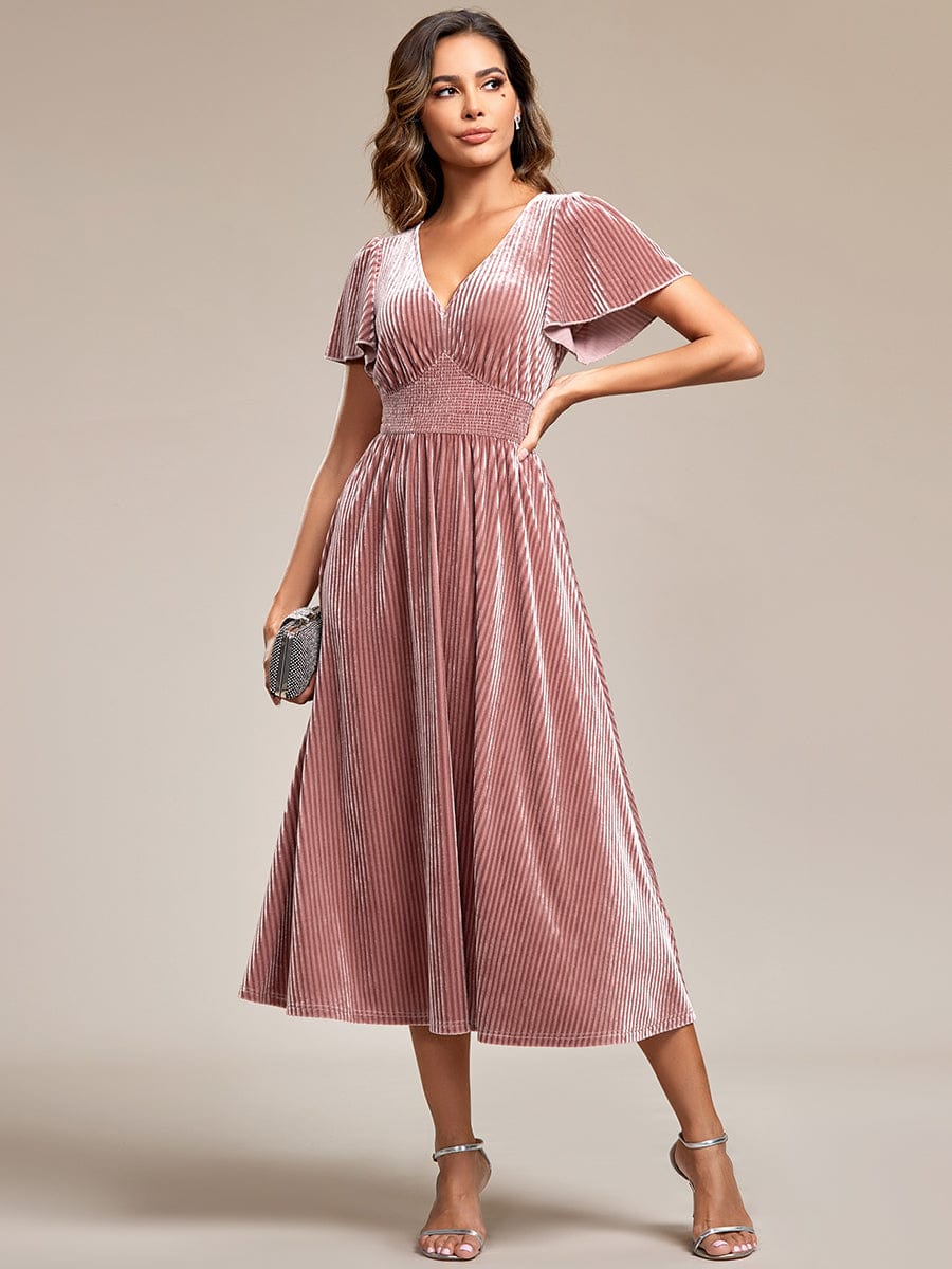 Model wearing an olive green Weitese velvet V-neck short sleeve midi dress.