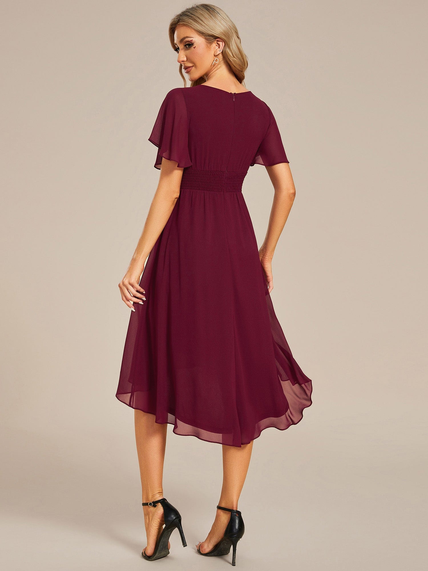 Model in a red Weitese chiffon A-line dress, showcasing the flowy skirt.