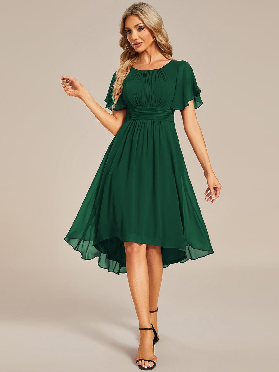 Model wearing a dark green Weitese flowy chiffon A-line knee-length dress.