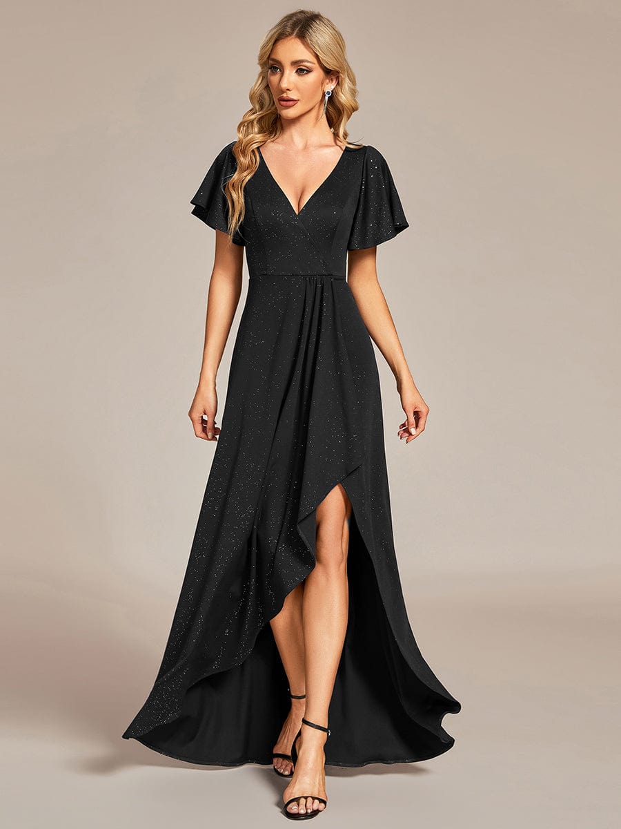 Woman wearing a black Weitese glitter high-low evening dress with ruffled V-neck.