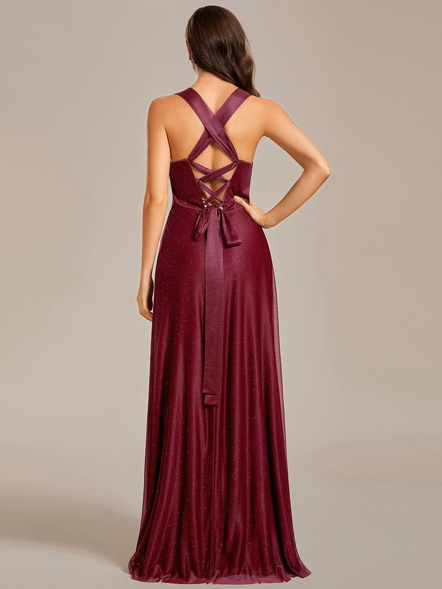 Close-up of the V-neckline and pleated details of the glittery bridesmaid dress.