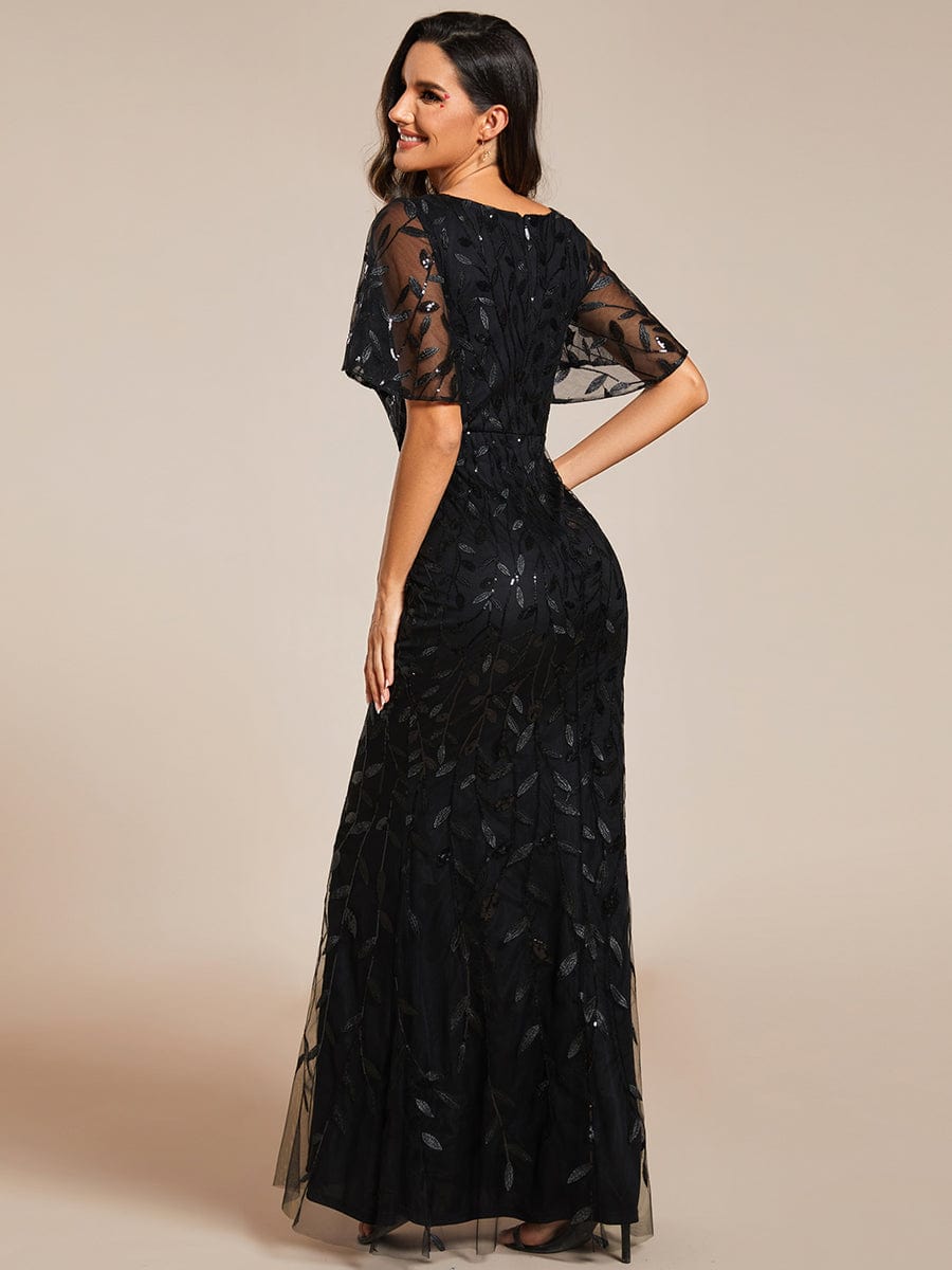 Black leaf-sequined V-neck fishtail gown, side.