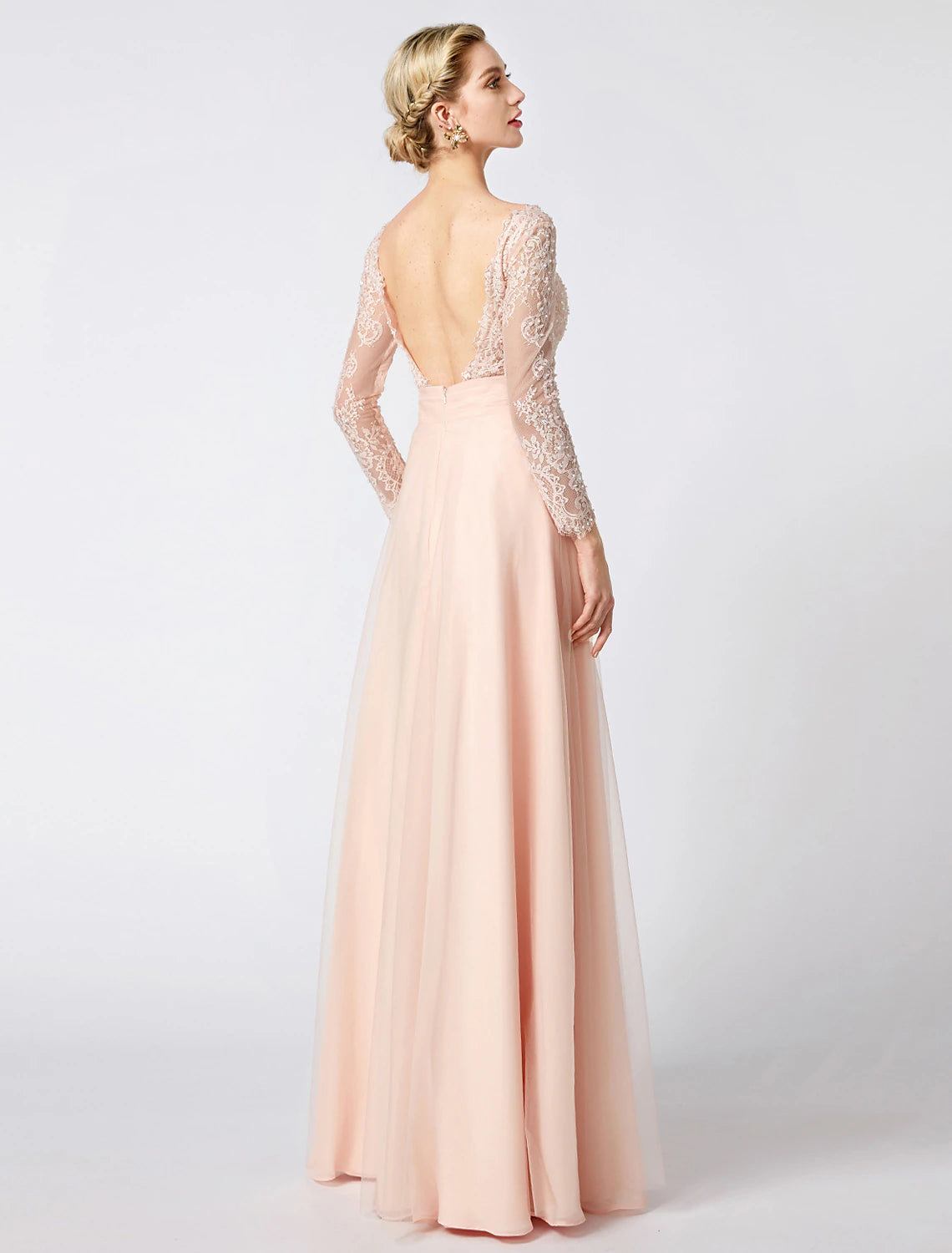 Close-up of the V-neckline and intricate beading on the bodice of the pastel gown.