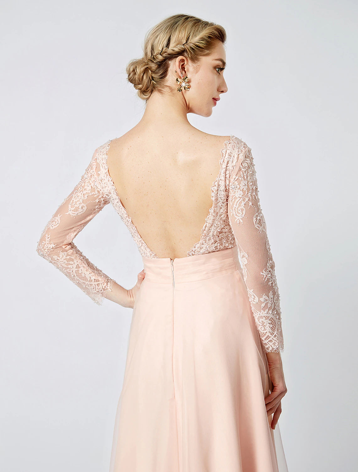 Detailed view of the delicate beading and tulle fabric on the pastel ball gown.