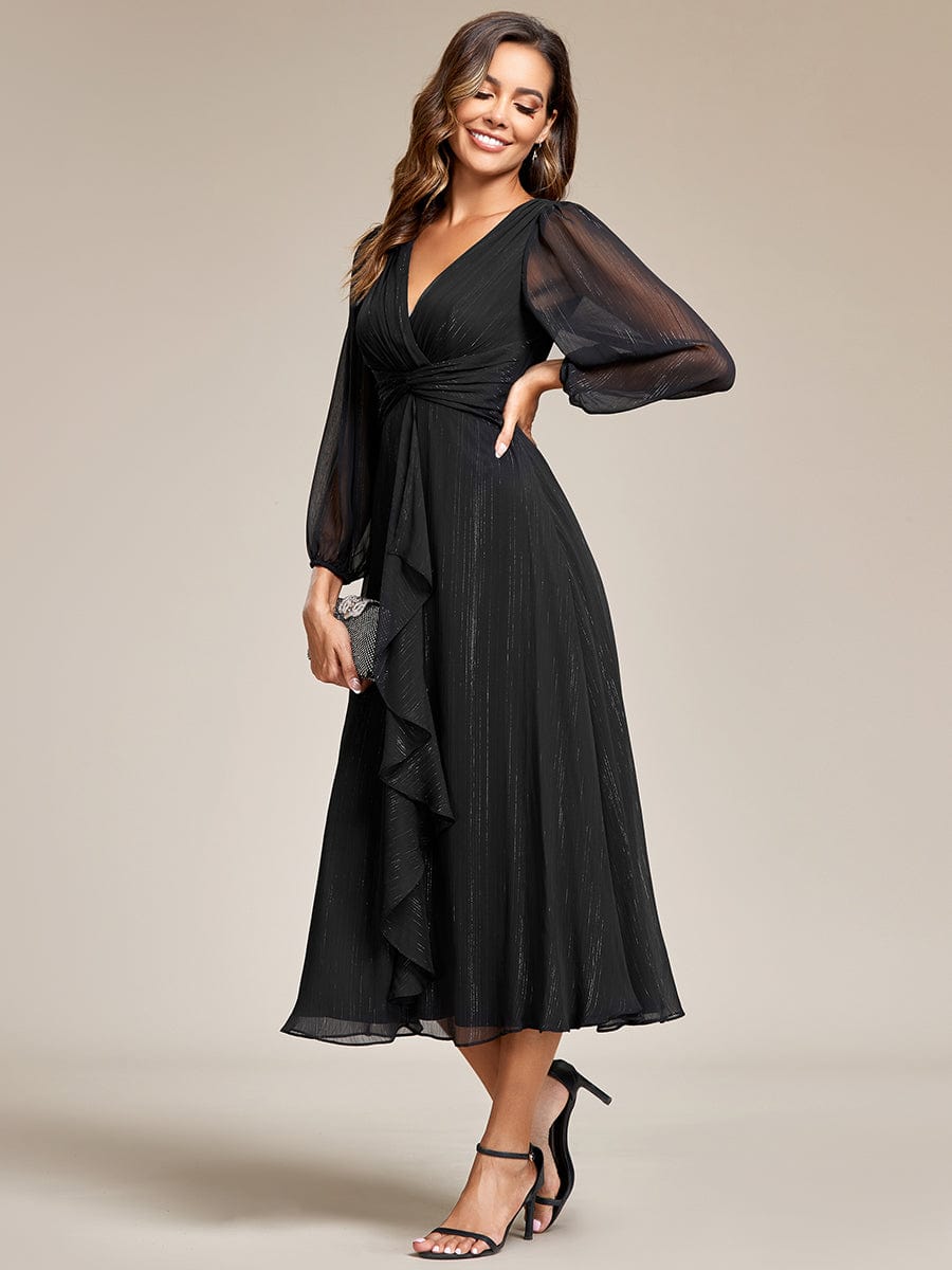 Model wearing a black Weitese shimmering A-line evening dress with sheer long sleeves.
