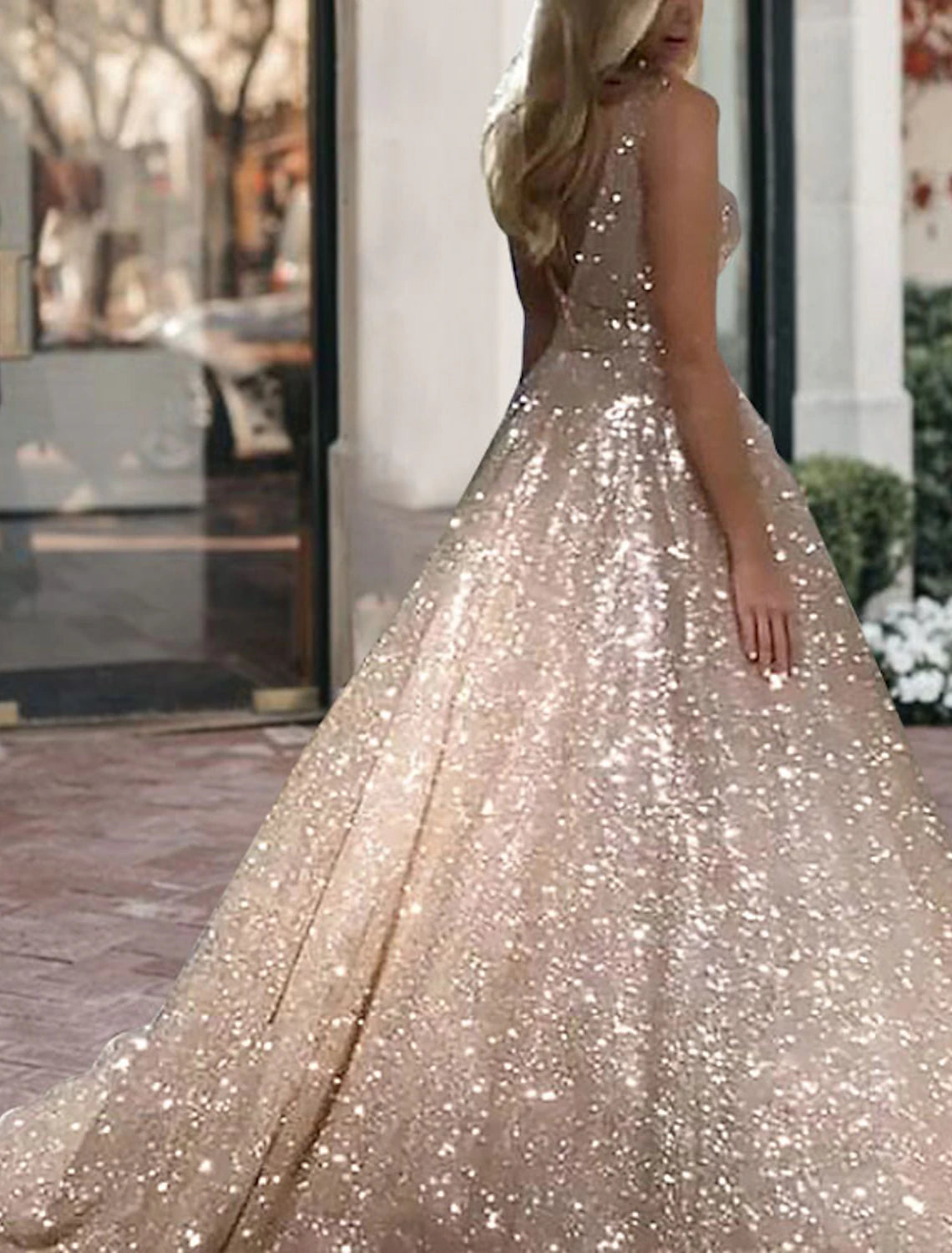 Weitese black tulle ball gown with V-neck and sequin details.