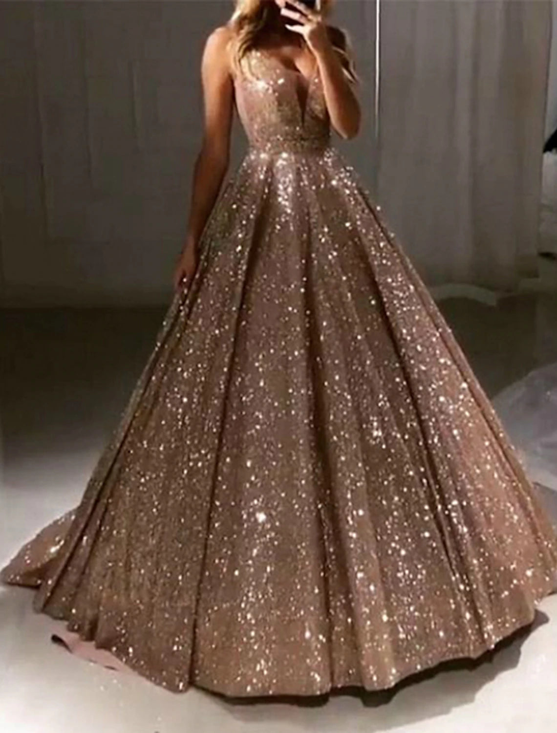 Back view of Weitese black ball gown, showing V-back and sweep train.