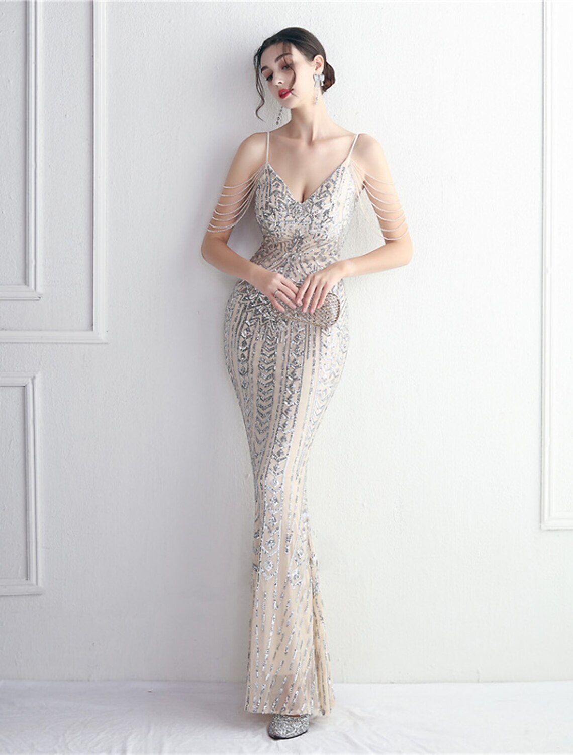 Close-up of the beaded and sequined detail on the sparkling evening gown.