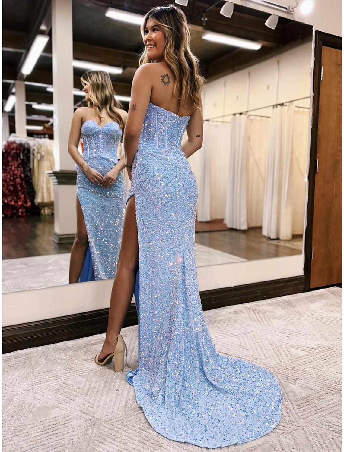 Back view of the Weitese sequined mermaid trumpet prom dress, showcasing the backless design and court train.