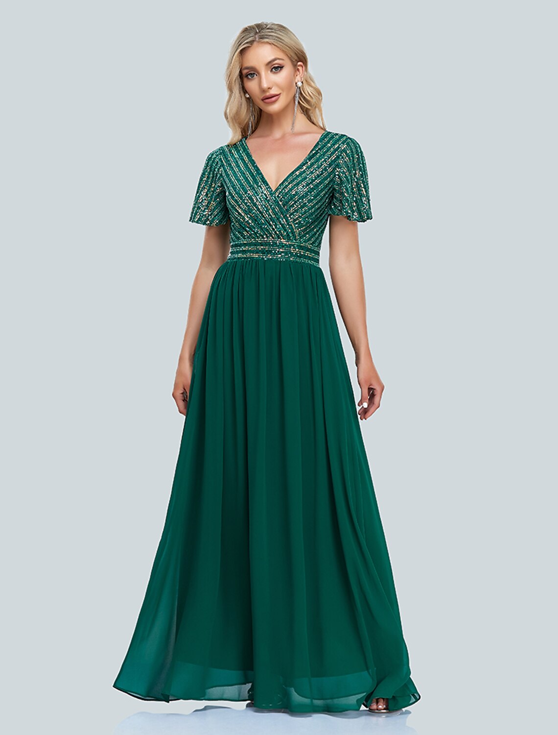 Woman wearing a sparkling mermaid V-neck short-sleeve evening gown.