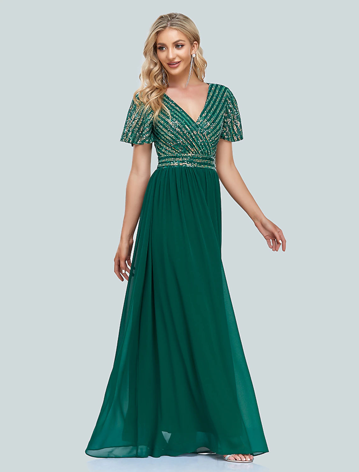Back view of a woman in a sparkling V-neck mermaid evening dress.