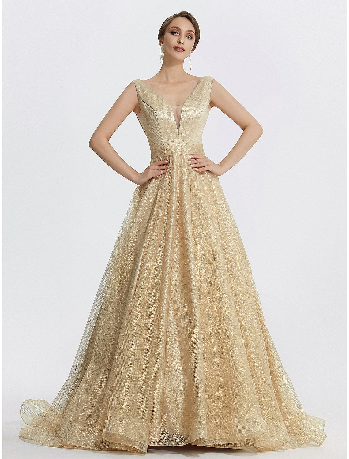 Model wearing a sparkling V-neck ball gown prom dress with glitter tulle.