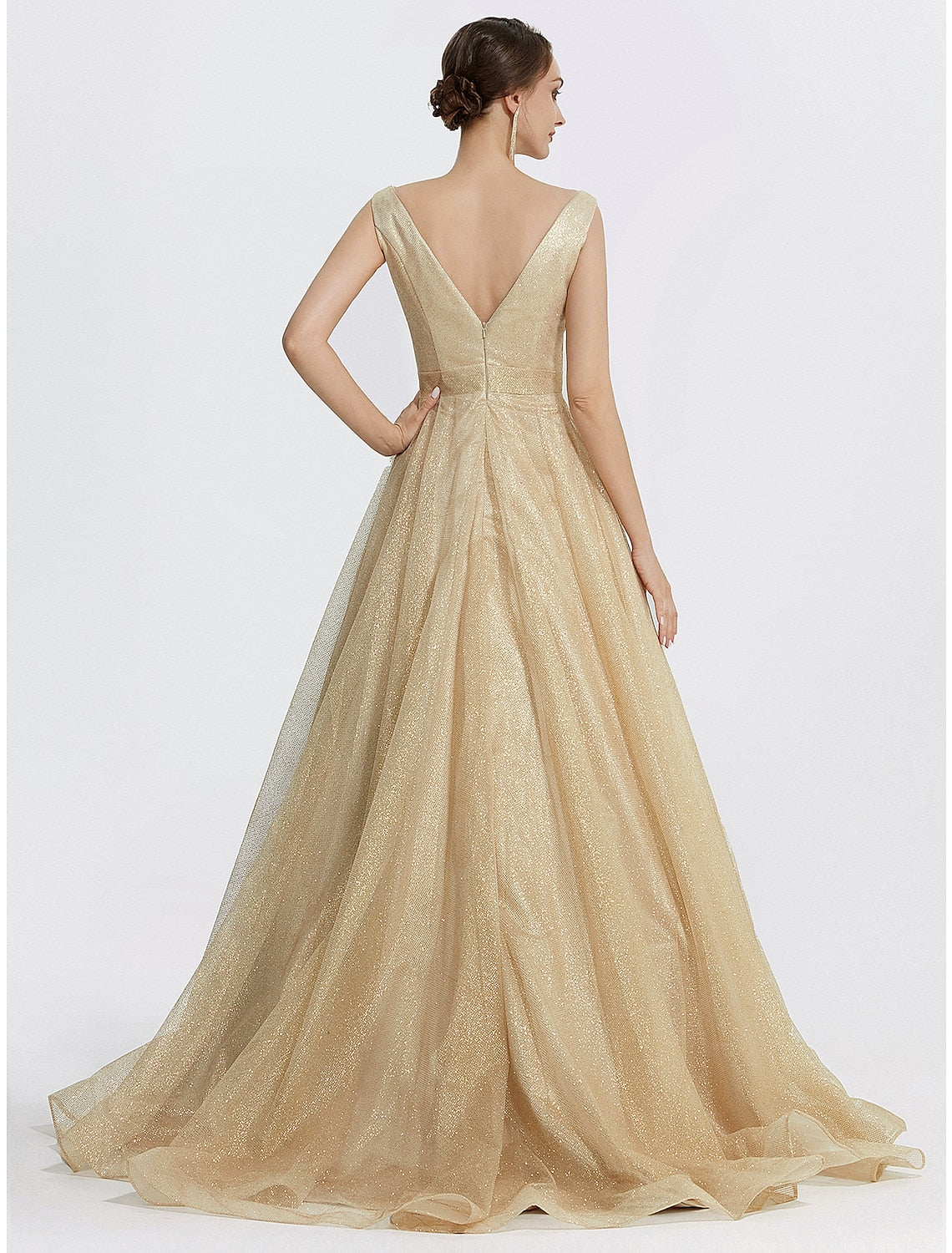Side view of the floor-length glitter tulle ball gown on a model.