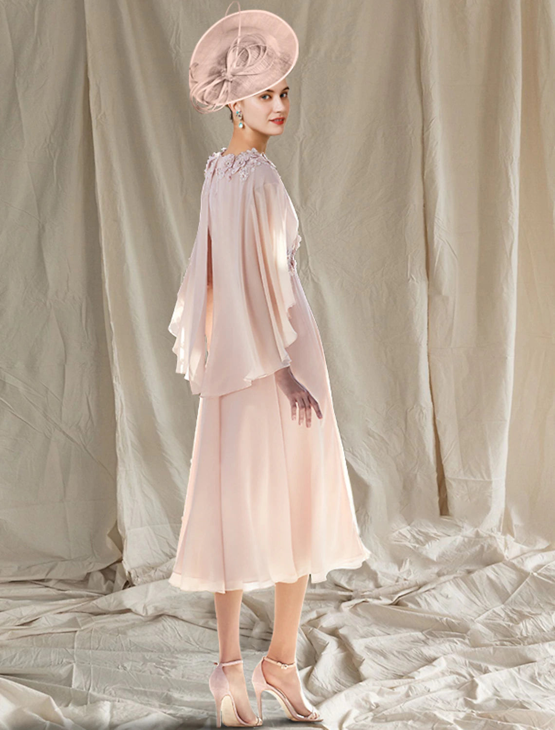 Side view of the elegant Weitese mother of the bride dress, showing the flow of the chiffon skirt.