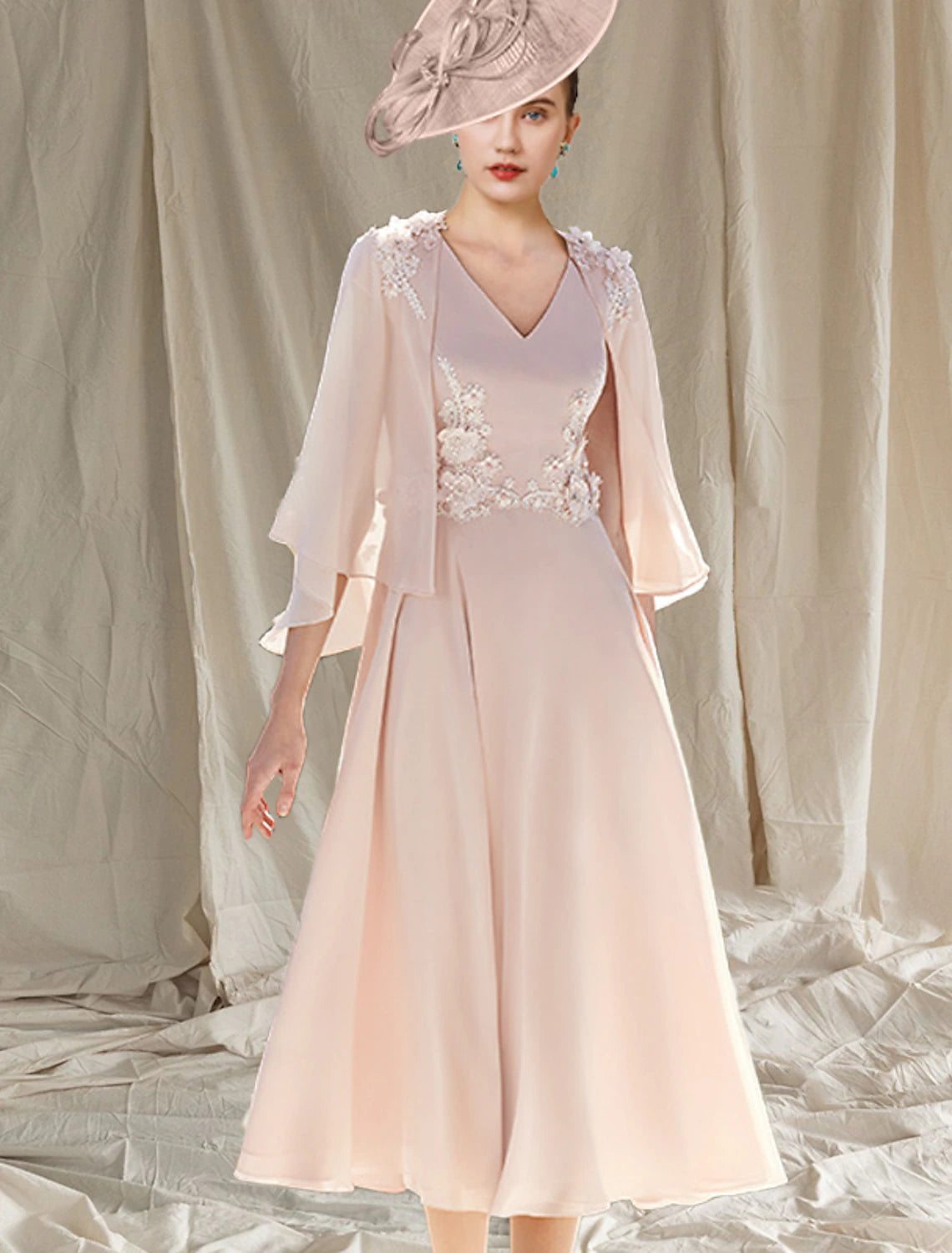 Back view of the Weitese two-piece dress, highlighting the appliques and tea-length design.