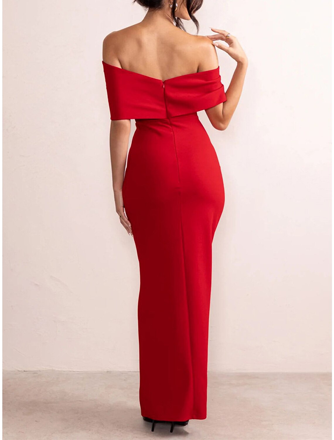 Back detail of the black off-shoulder maxi dress.