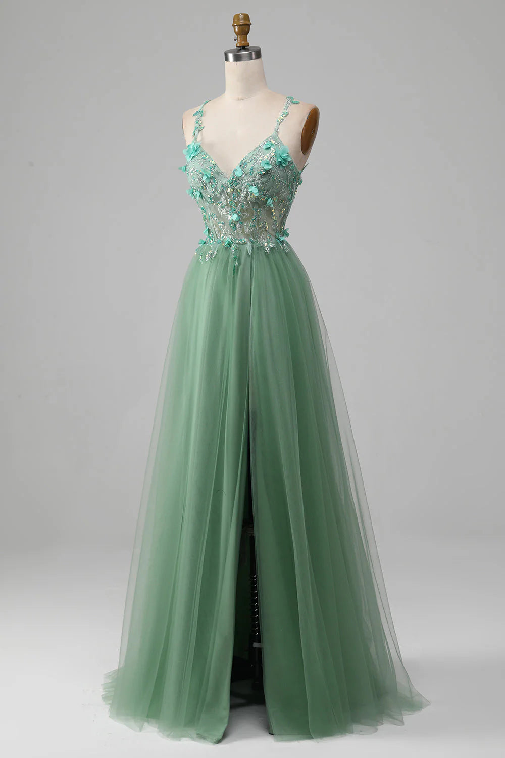 Robe de bal trapèze verte scintillante à bretelles spaghetti et corset avec applications