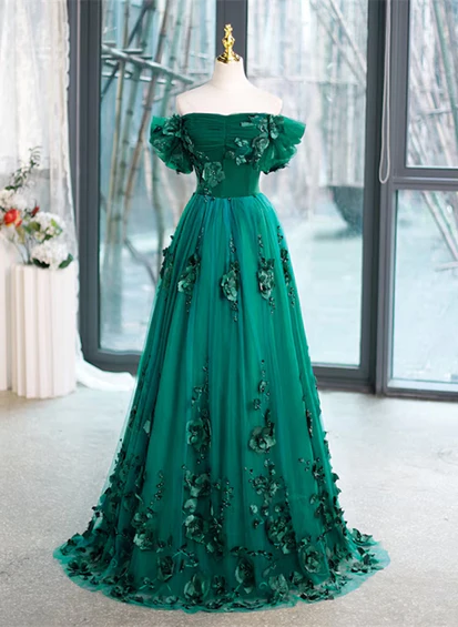 Belle robe de soirée verte à épaules dénudées et fleurs